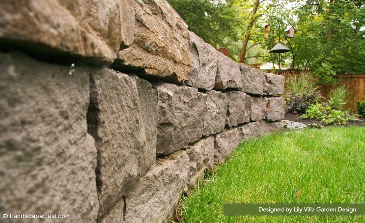 Stacked stone retaining wall
