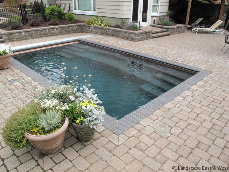 Pool water feature with paver surround