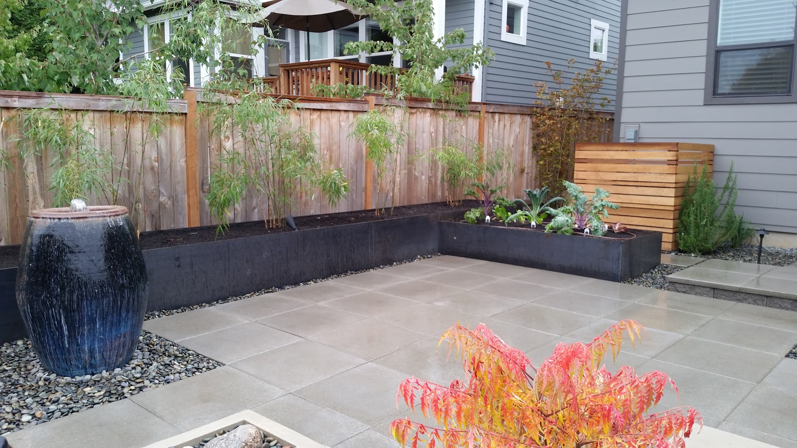 Raised garden and retaining wall constructed with raw steel