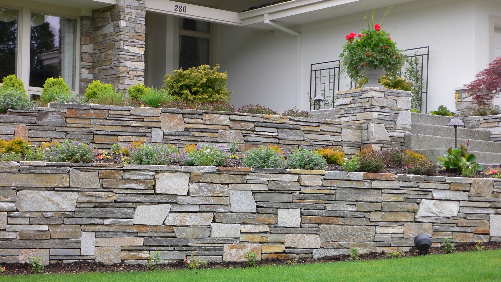 Terraced retaining wall featuring mica ledgestone